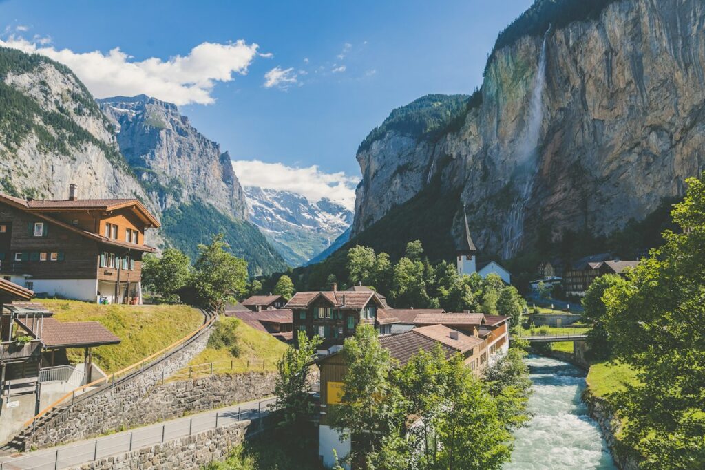 Breathtaking snow-dusted peaks and serene alpine valley in the Swiss Alps